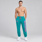 Custom Aqua Fleece Jogger Sweatpants with Pink Accents worn by male model