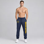 Custom Navy Fleece Jogger Sweatpants with Gold Accents worn by male model