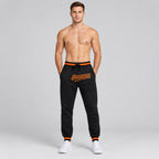 Custom Black Pants with Black and Orange Accents worn by male model