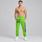Custom Neon Green Fleece Jogger Sweatpants with Purple Accents worn by male model