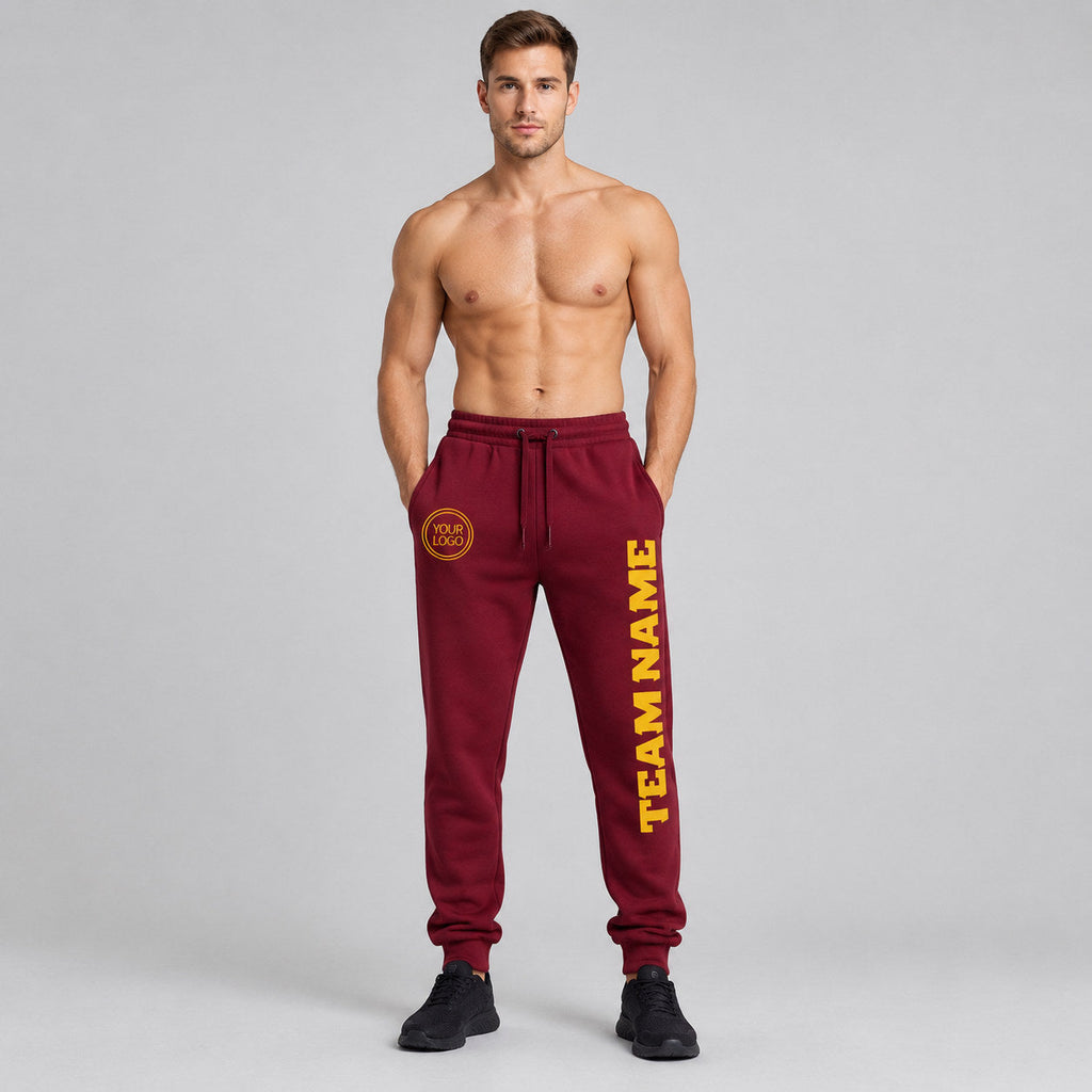 Custom Crimson Fleece Jogger Sweatpants with Gold Accents worn by male model