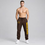 Custom Brown Fleece Jogger Sweatpants with Gold Accents worn by male model