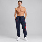 Custom Navy Fleece Jogger Sweatpants with Red Accents worn by male model