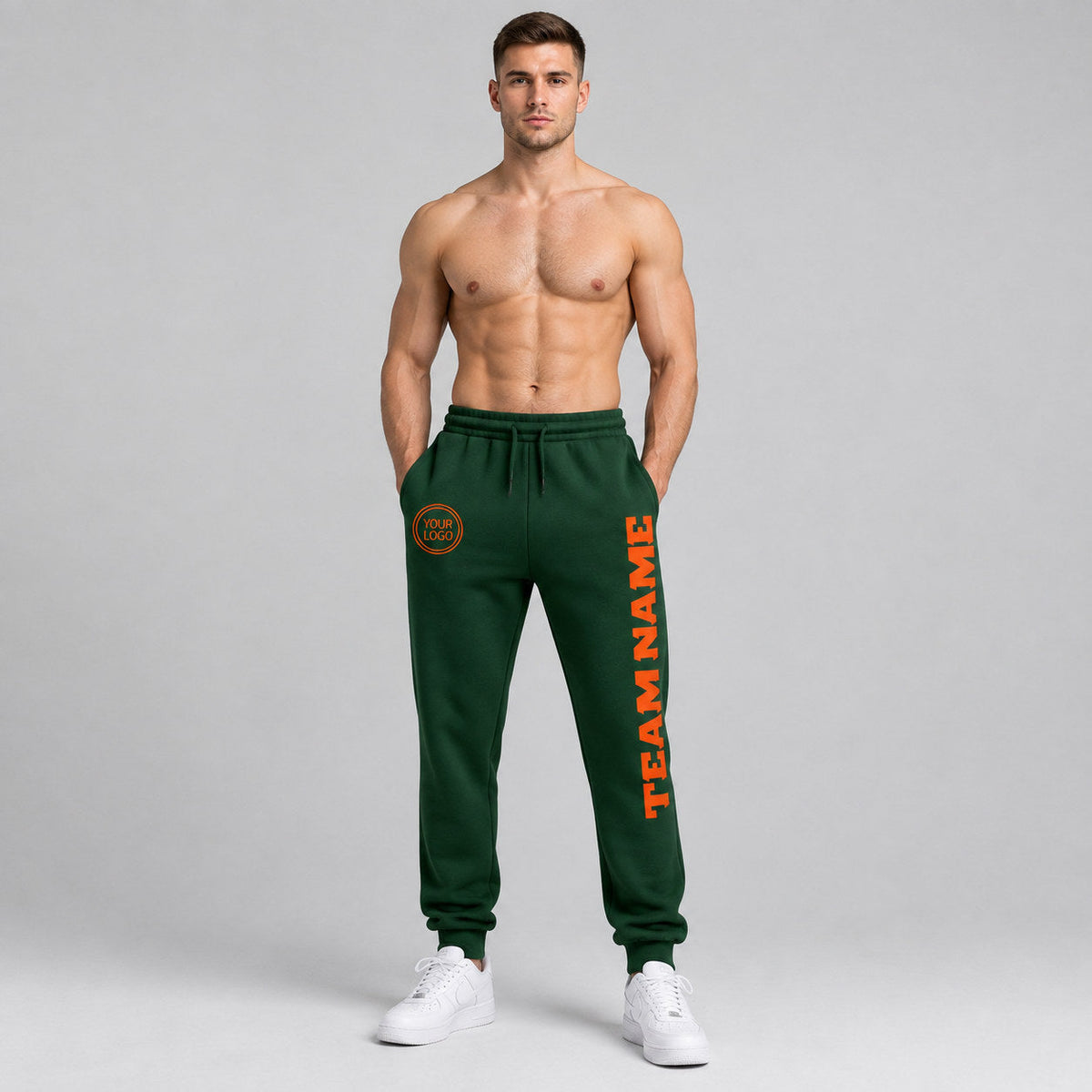 Custom Green Fleece Jogger Sweatpants with Orange Accents worn by male model
