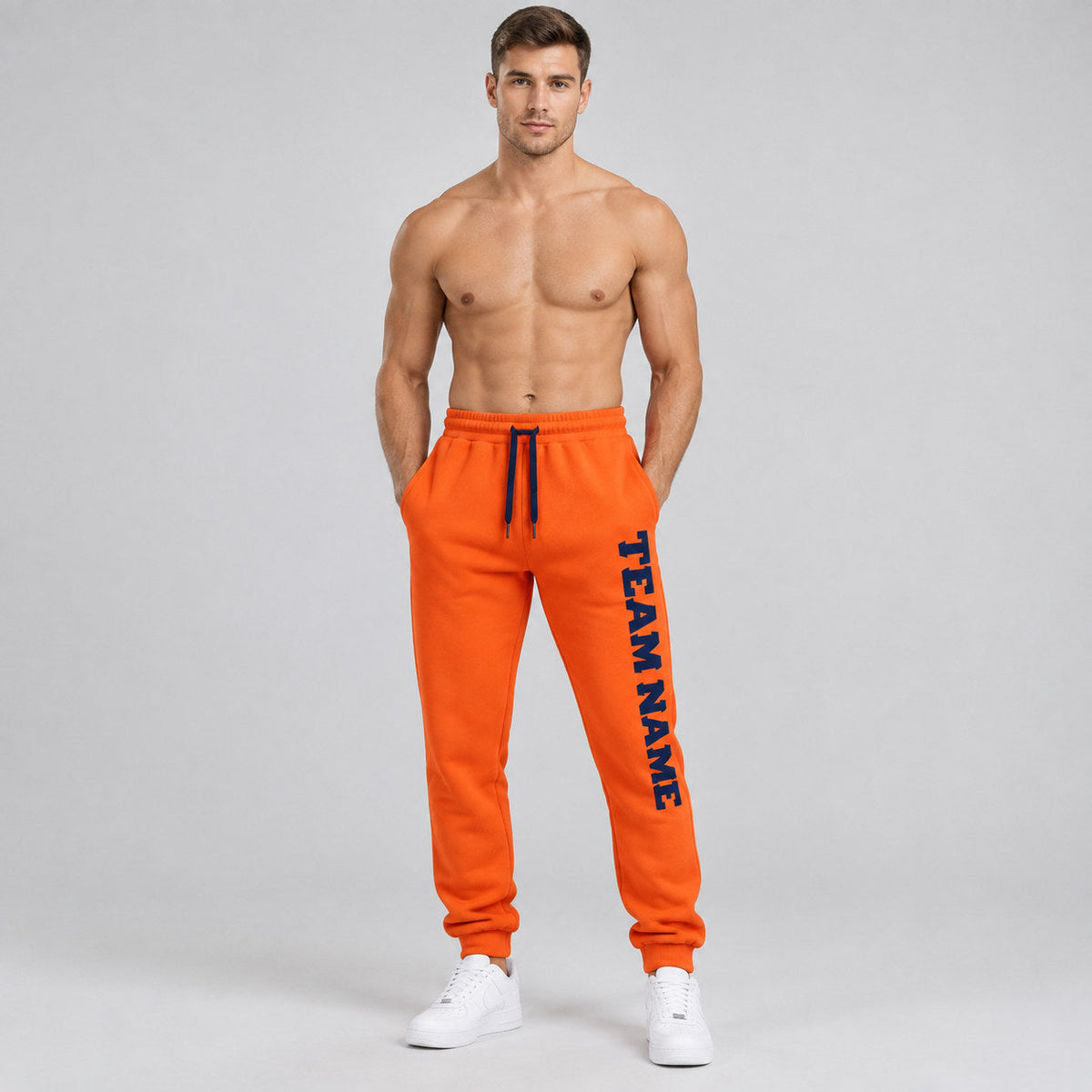 Custom Orange Fleece Jogger Sweatpants with Navy Accents worn by male model