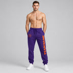 Custom Purple Fleece Jogger Sweatpants with Orange Accents worn by male model