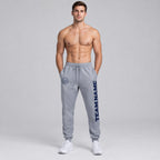 Custom Gray Fleece Jogger Sweatpants with Navy Accents worn by male model
