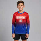 Custom Red Fade Long Sleeve Sublimated Soccer Jersey with White and Royal Lettering youth size worn by child model