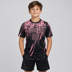 Custom Black Sublimated Soccer Jersey with Medium Pink Lettering youth size worn by child model