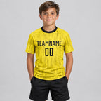 Custom Gold Sublimated Soccer Jersey with Black Lettering Design 0062 youth size worn by child model
