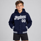 Custom Navy Full Snap Bomber Hooded Varsity Jacket with White Accents Design 3108 youth size worn by child model