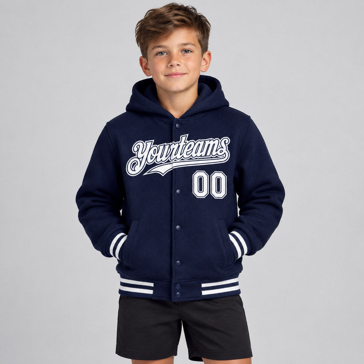 Custom Navy Full Snap Bomber Hooded Varsity Jacket with White Accents Design 3108 youth size worn by child model