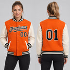 Custom Orange Full Snap Bomber Two Tone Varsity Jacket with Black and Cream Accents Design 4532 worn by female model