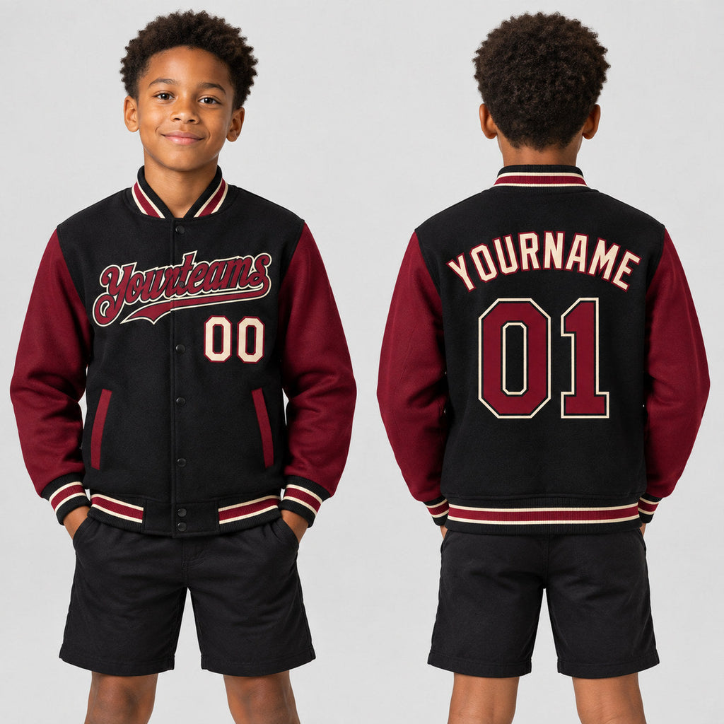 Custom Black Full Snap Bomber Two Tone Varsity Jacket with Crimson and City Cream Accents youth size worn by child model