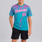 Custom Aqua Distressed Scratch Brush Stroke Performance T-Shirt with Pink and White Lettering youth size worn by child model