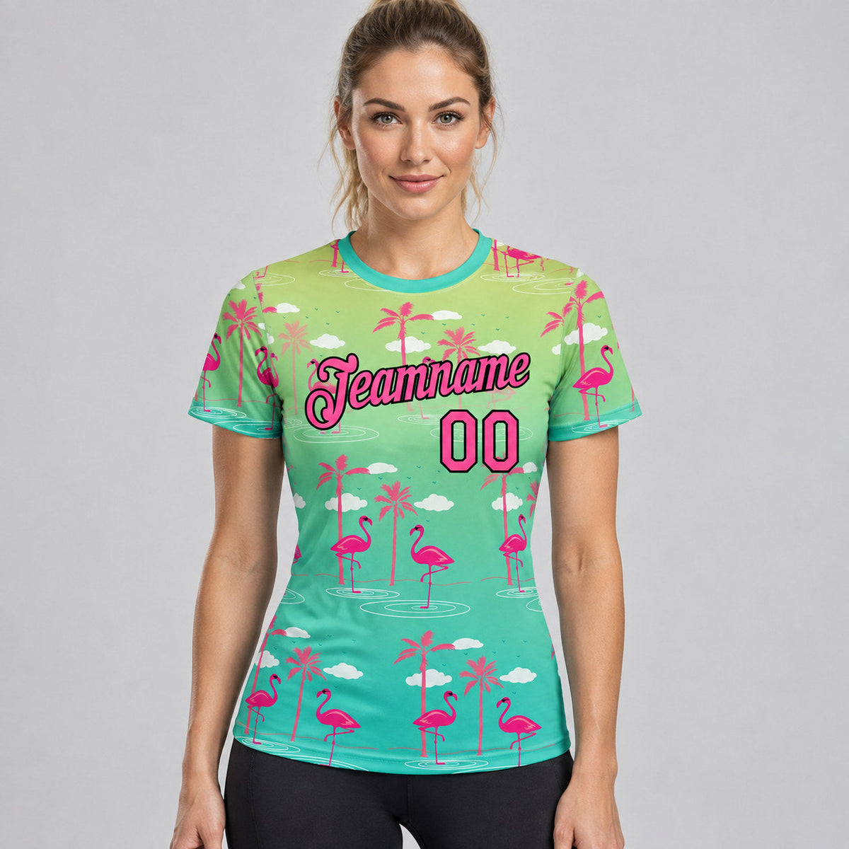 Custom Green Tropical Hawaii Flamingo Performance T-Shirt with Pink and Black Lettering worn by female model