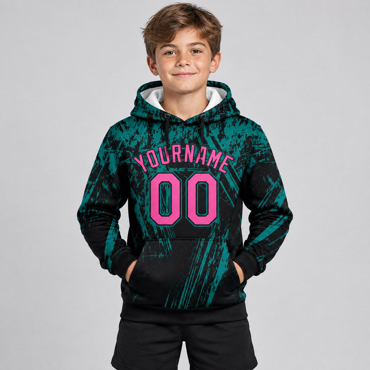 Custom Black Splash Grunge Art Pullover Hoodie with Pink and Teal Lettering youth size worn by child model