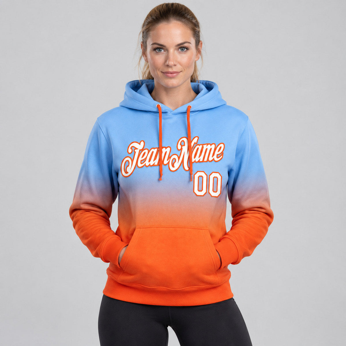 Custom Light Blue Fade Pullover Hoodie with White and Orange Lettering worn by female model