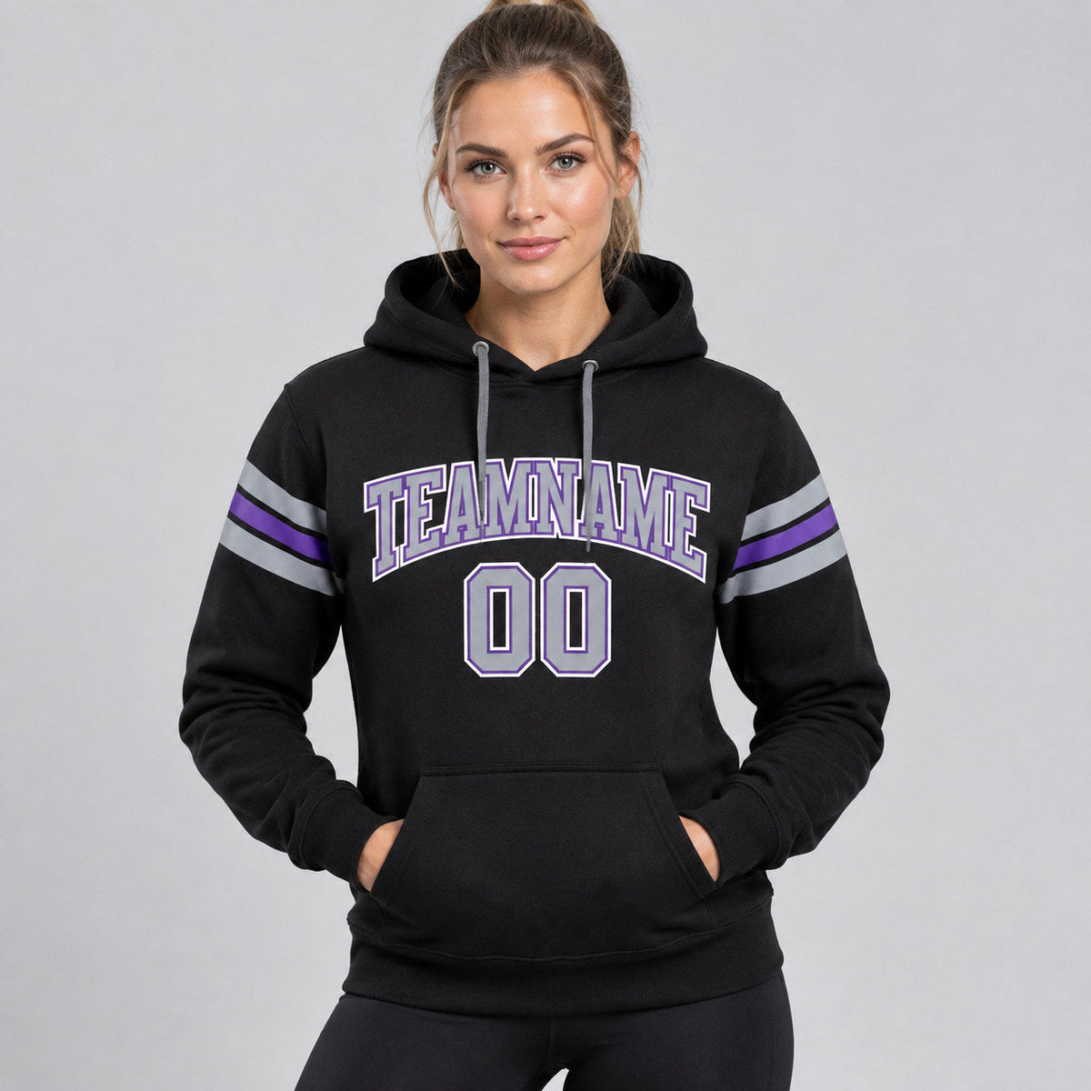 Custom Black Football Pullover Hoodie with Gray and Purple Lettering worn by female model