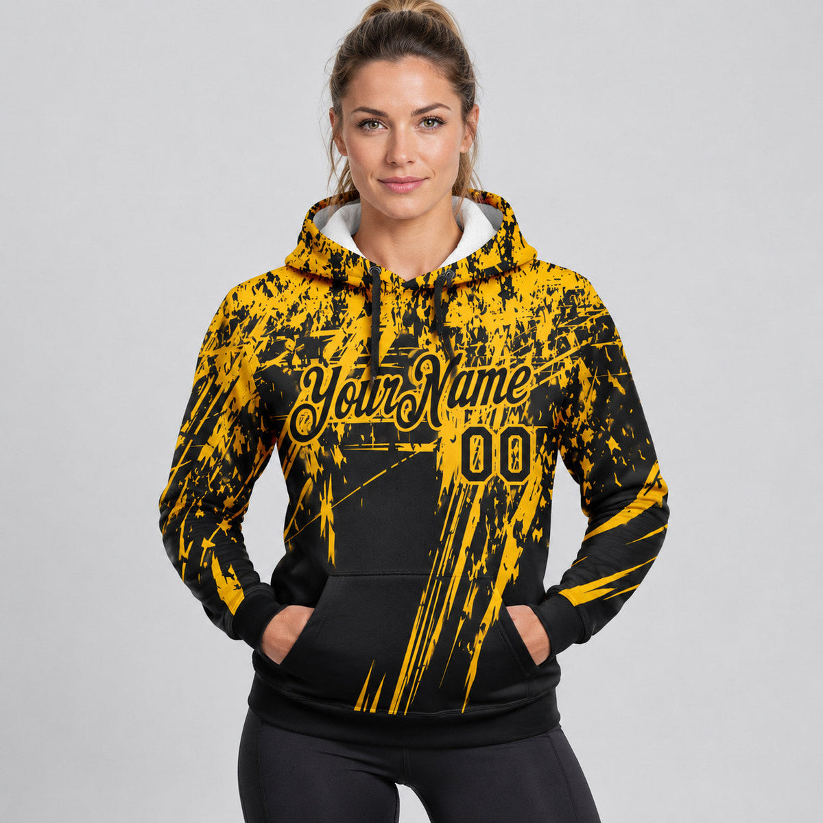 Custom Black Splash Grunge Art Pullover Hoodie with Gold Lettering worn by female model