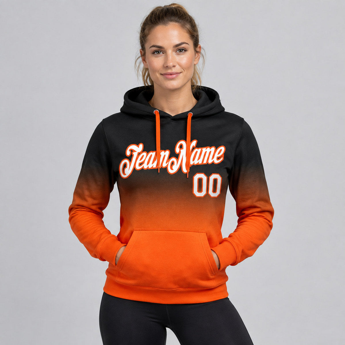 Custom Black Fade Pullover Hoodie with White and Orange Lettering worn by female model