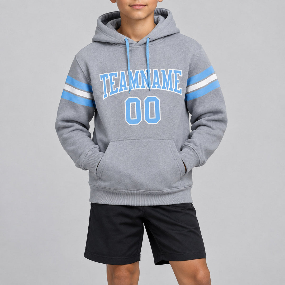 Custom Gray Football Pullover Hoodie with Light Blue and White Lettering youth size worn by child model