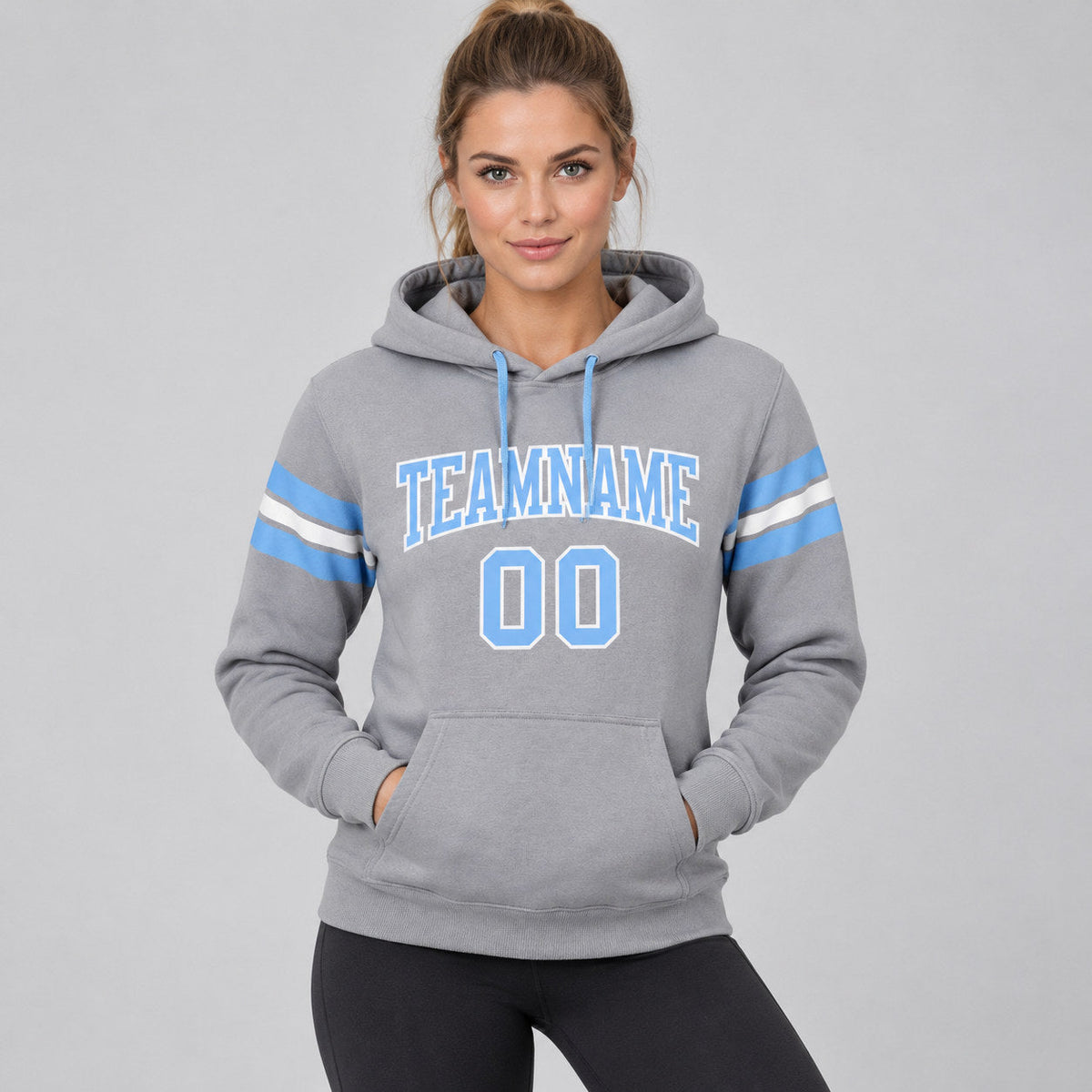 Custom Gray Football Pullover Hoodie with Light Blue and White Lettering worn by female model