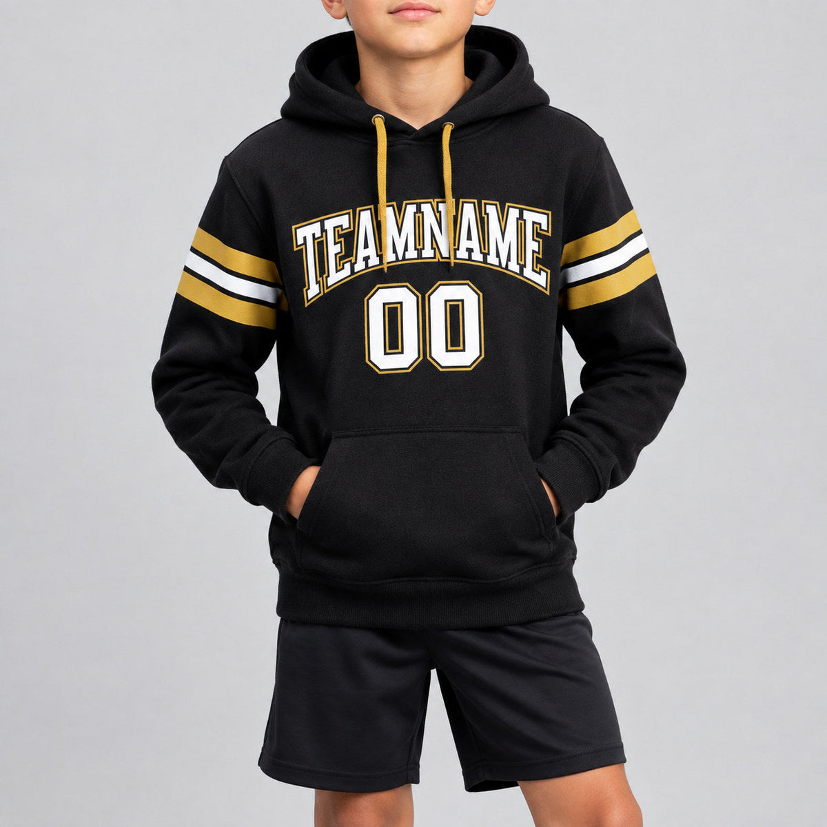 Custom Black Football Pullover Hoodie with White and Old Gold Lettering youth size worn by child model