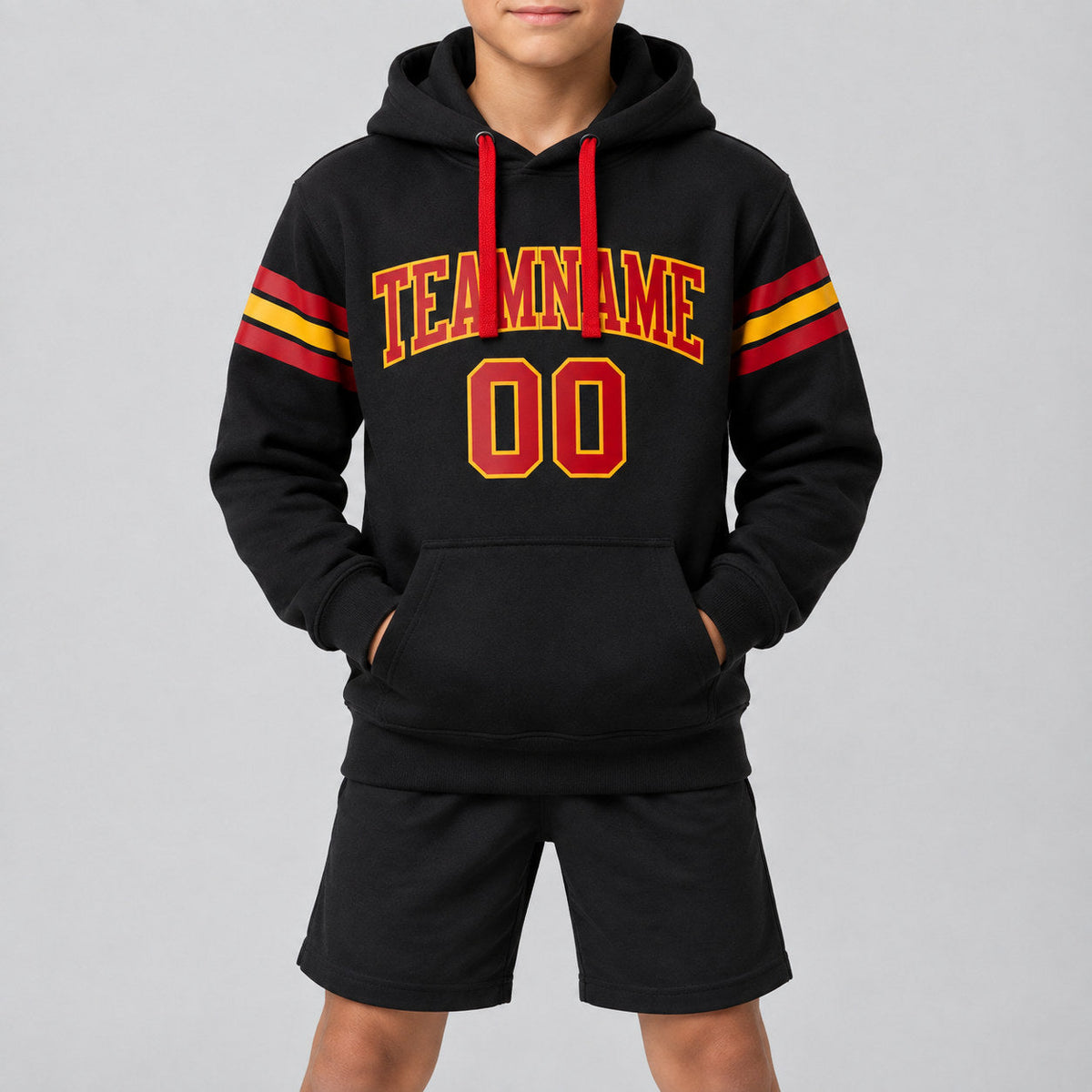 Custom Black Football Pullover Hoodie with Red and Gold Lettering youth size worn by child model