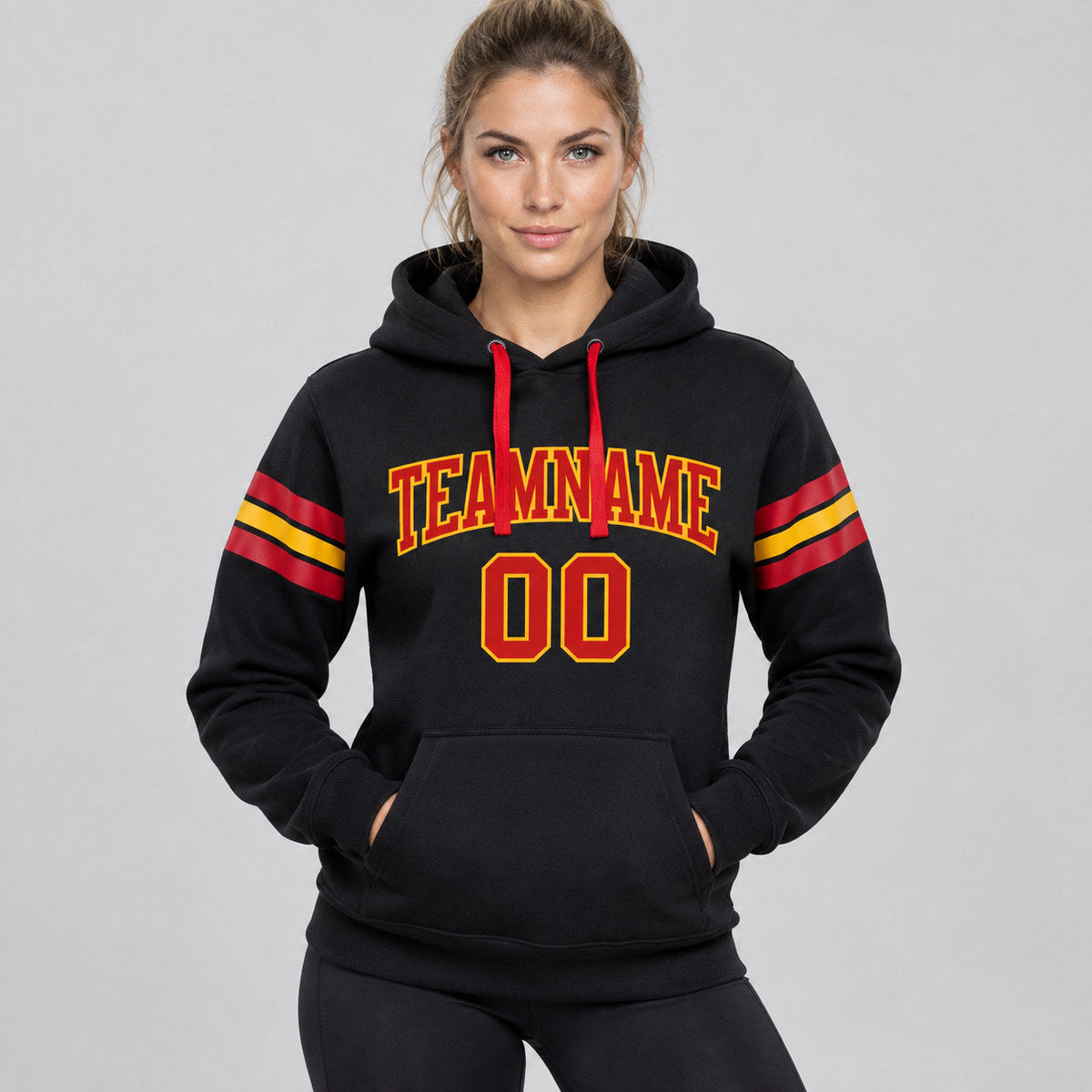 Custom Black Football Pullover Hoodie with Red and Gold Lettering worn by female model