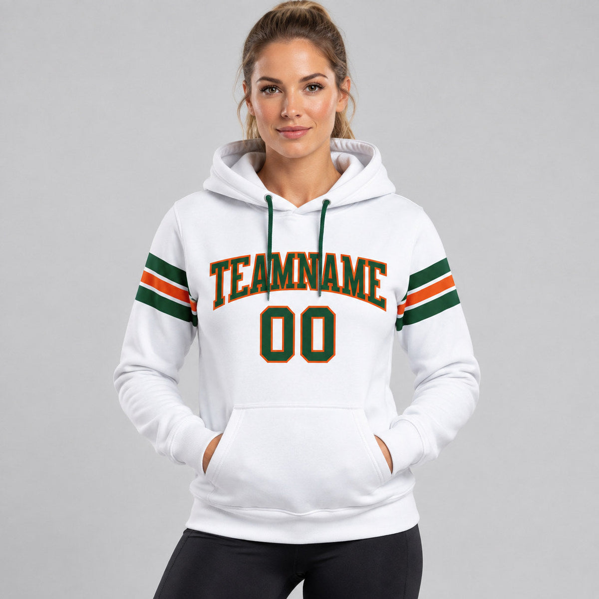 Custom White Football Pullover Hoodie with Green and Orange Lettering worn by female model