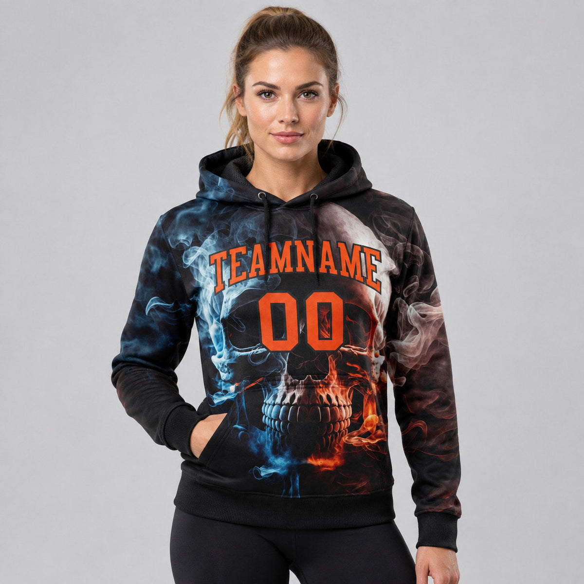 Custom Black Skull Pullover Hoodie with Orange Lettering worn by female model