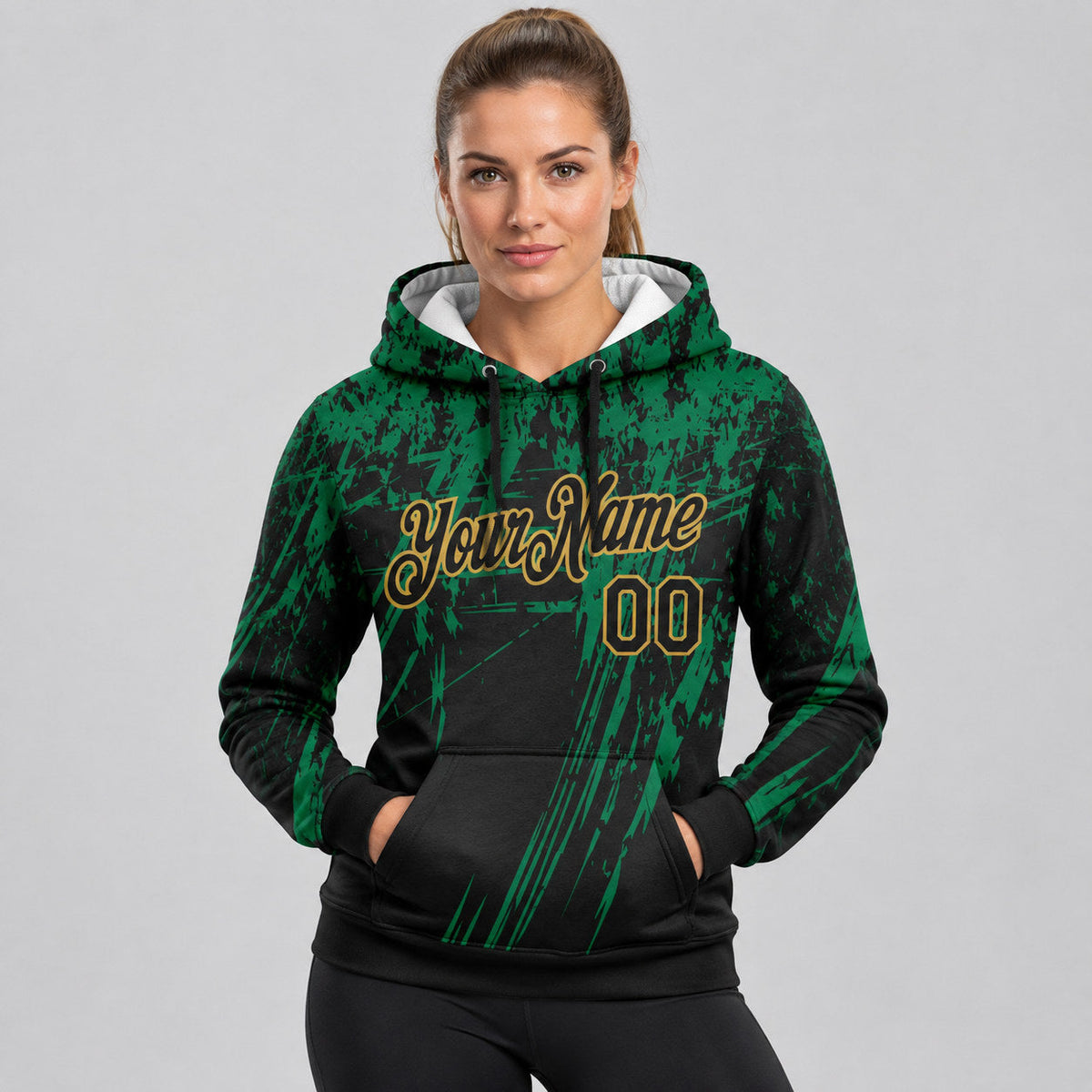 Custom Black Splash Grunge Art Pullover Hoodie with Kelly Green and Old Gold Lettering worn by female model