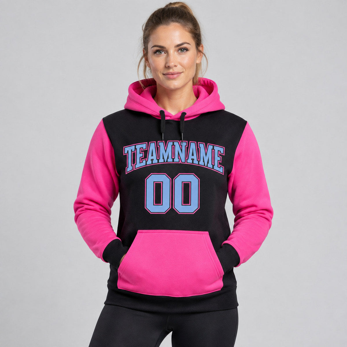 Custom Black Pullover Hoodie with Light Blue and Pink Lettering worn by female model