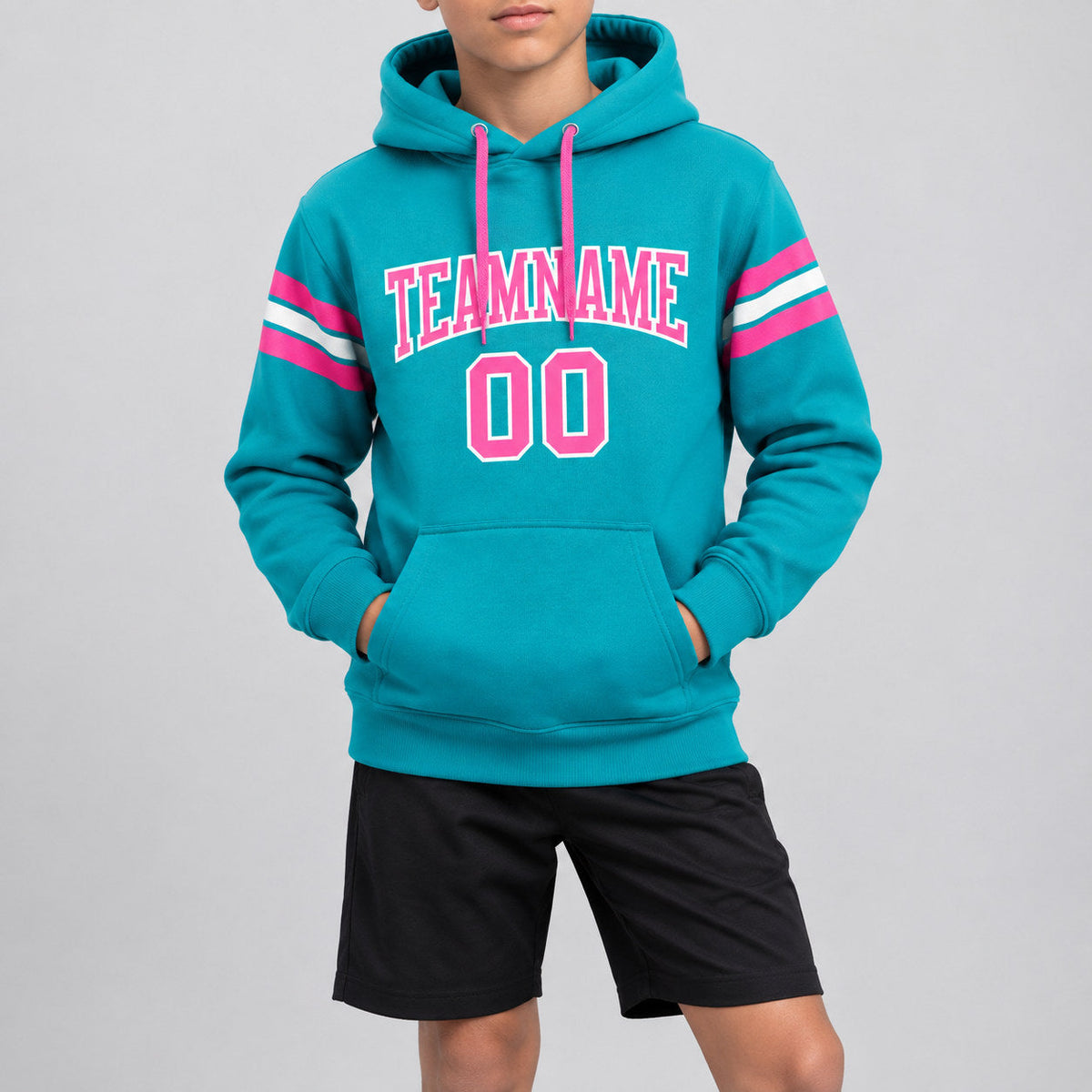 Custom Aqua Football Pullover Hoodie with Pink and White Lettering youth size worn by child model