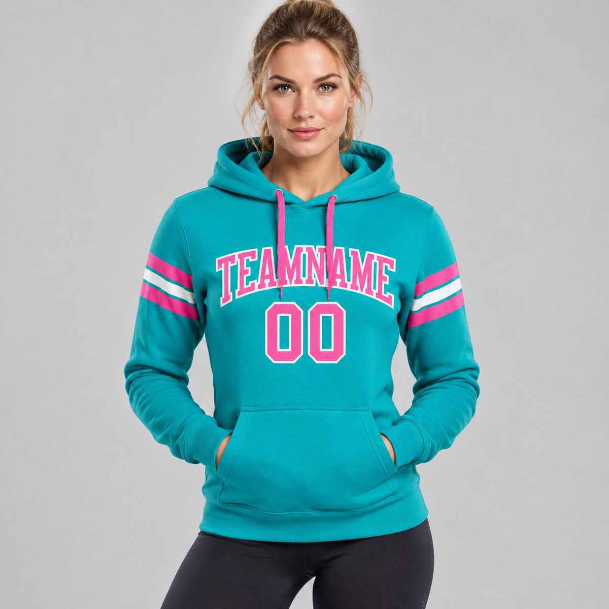 Custom Aqua Football Pullover Hoodie with Pink and White Lettering worn by female model