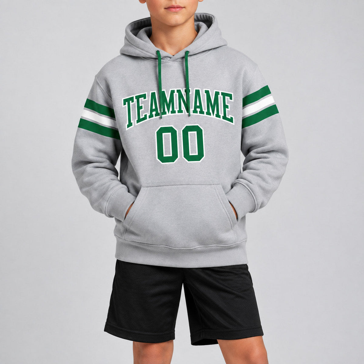Custom Gray Football Pullover Hoodie with Kelly Green and White Lettering youth size worn by child model