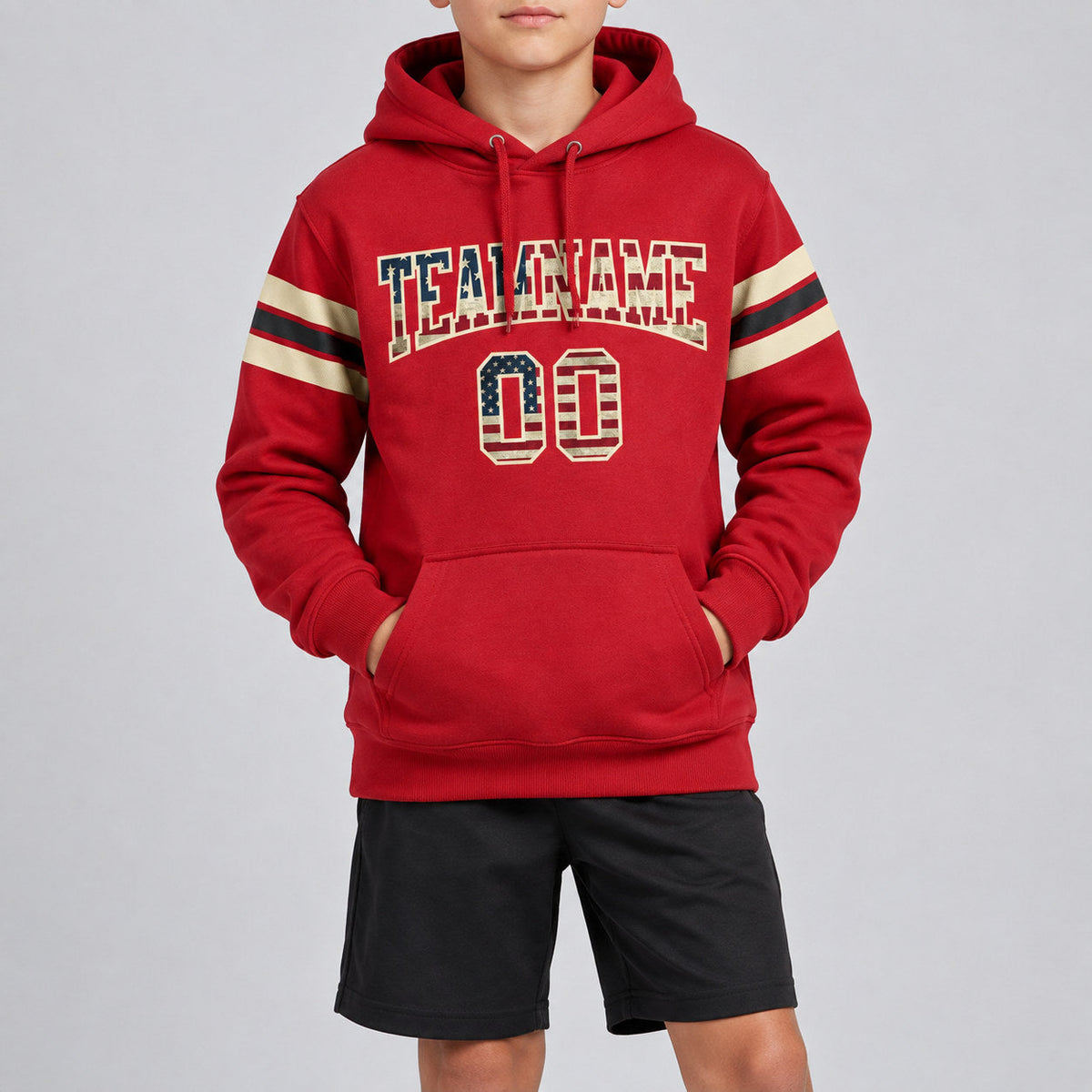 Custom Red Vintage USA Flag Football Pullover Hoodie with City Cream and Black Lettering youth size worn by child model