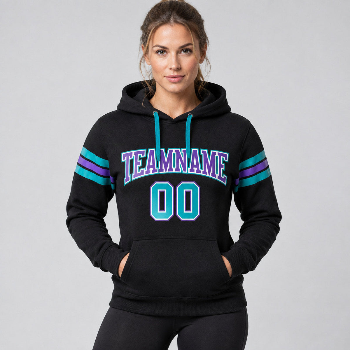 Custom Black Football Pullover Hoodie with Teal and Purple Lettering worn by female model