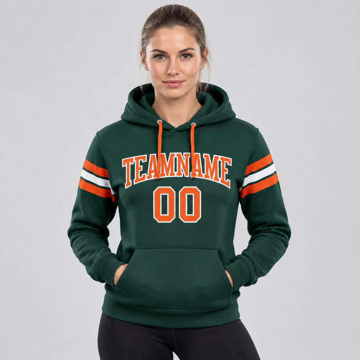 Custom Green Football Pullover Hoodie with Orange and White Lettering worn by female model