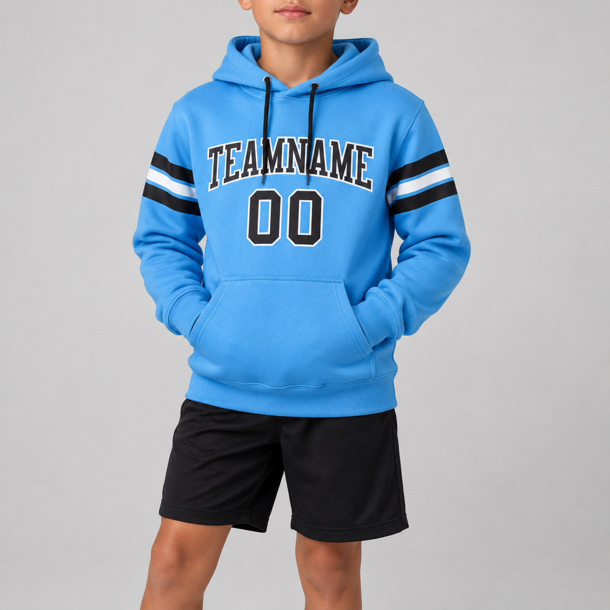 Custom Powder Blue Football Pullover Hoodie with Black and White Lettering youth size worn by child model