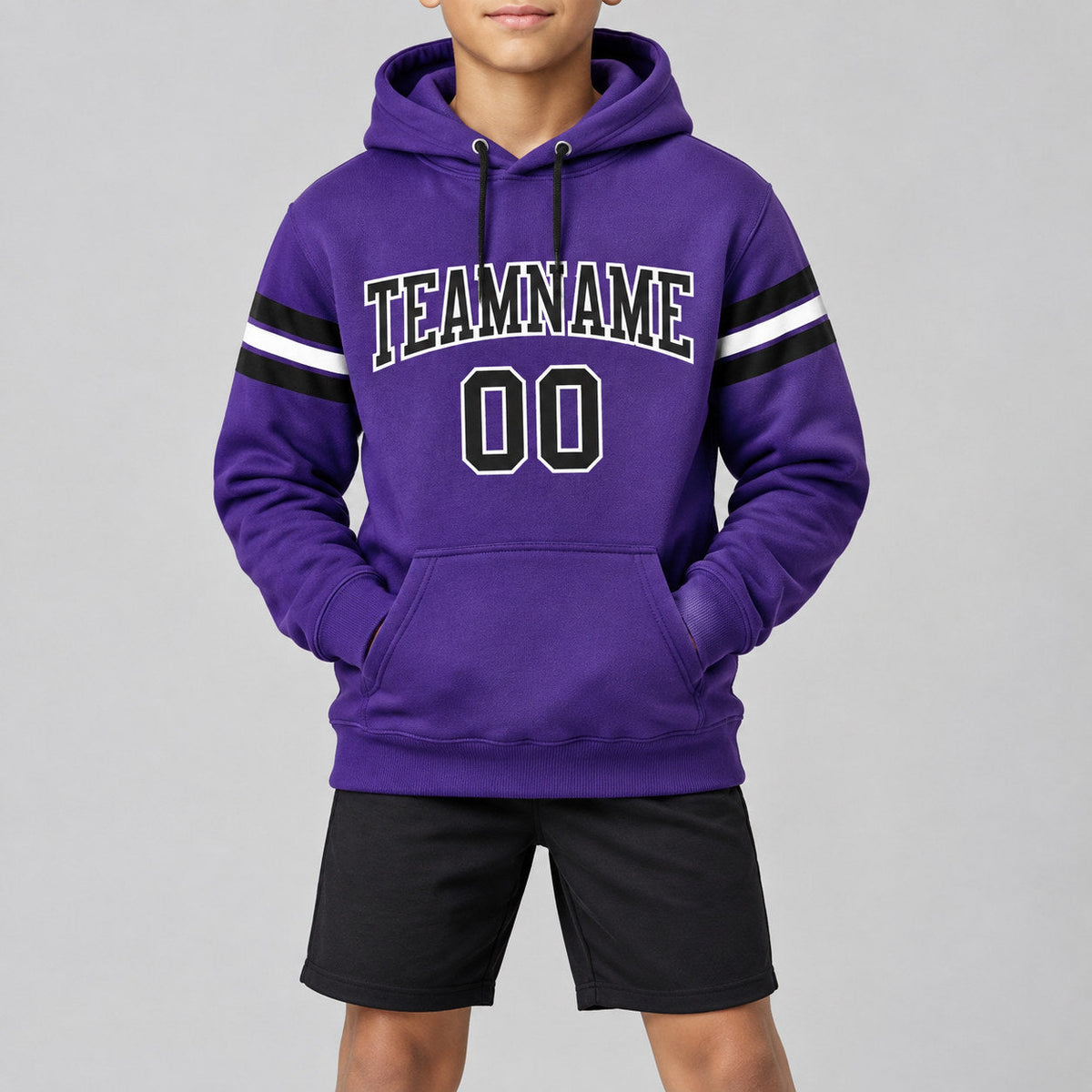Custom Purple Football Pullover Hoodie with Black and White Lettering youth size worn by child model
