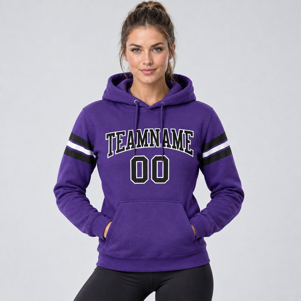 Custom Purple Football Pullover Hoodie with Black and White Lettering worn by female model