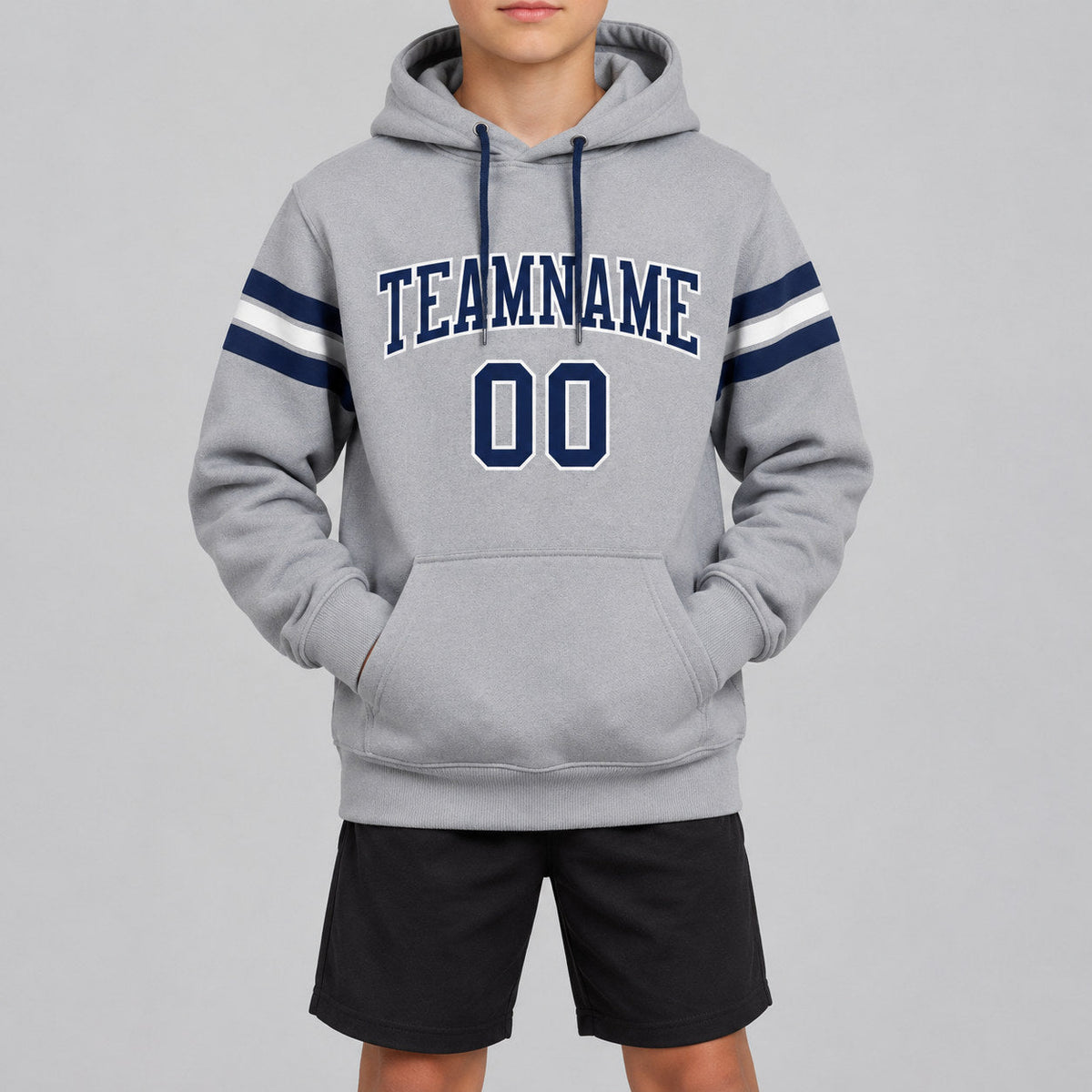 Custom Gray Football Pullover Hoodie with Navy and White Lettering youth size worn by child model