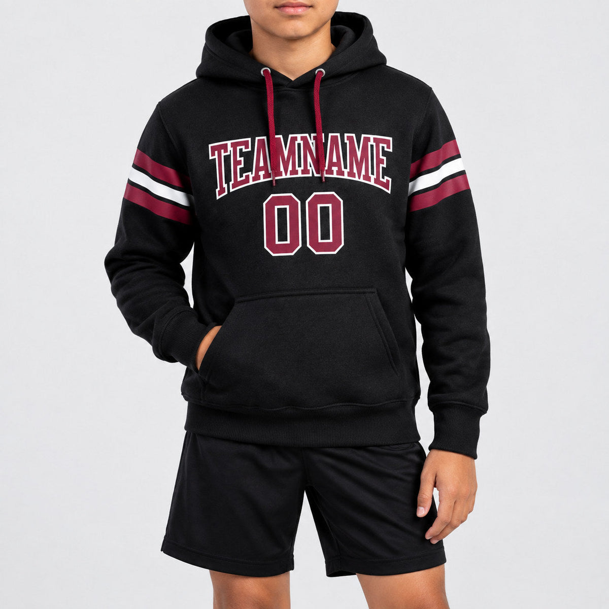 Custom Black Football Pullover Hoodie with Crimson and White Lettering youth size worn by child model