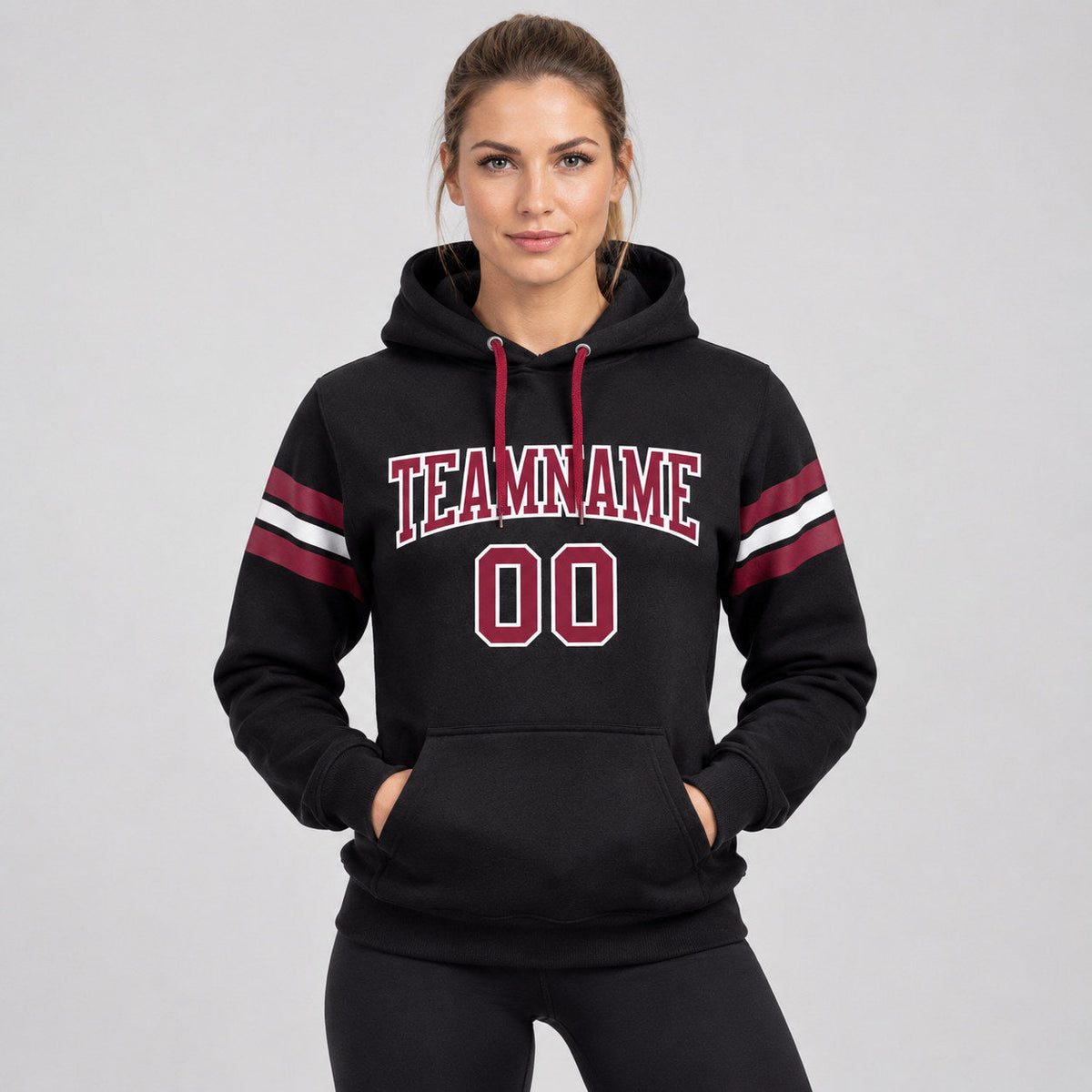 Custom Black Football Pullover Hoodie with Crimson and White Lettering worn by female model