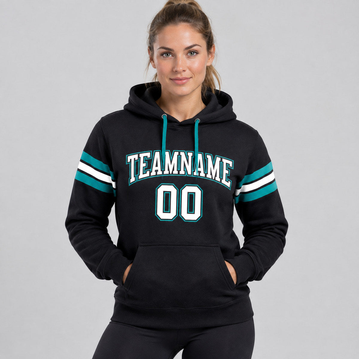 Custom Black Football Pullover Hoodie with White and Aqua Lettering worn by female model