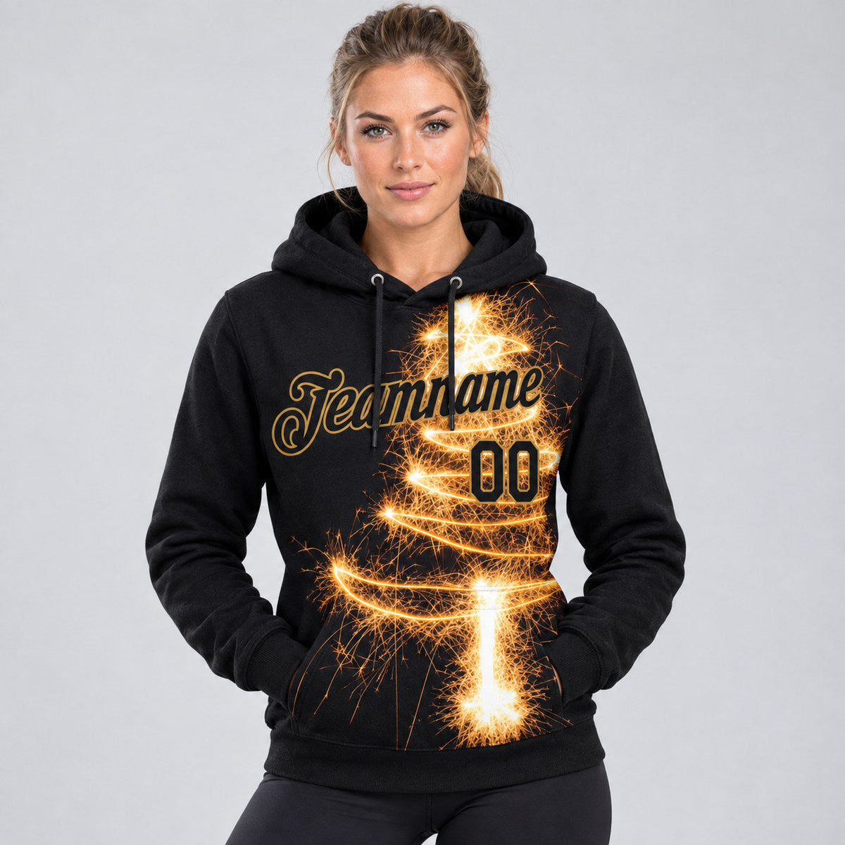 Custom Black Christmas Tree Fireworks Pullover Hoodie with Old Gold and Gold Lettering worn by female model
