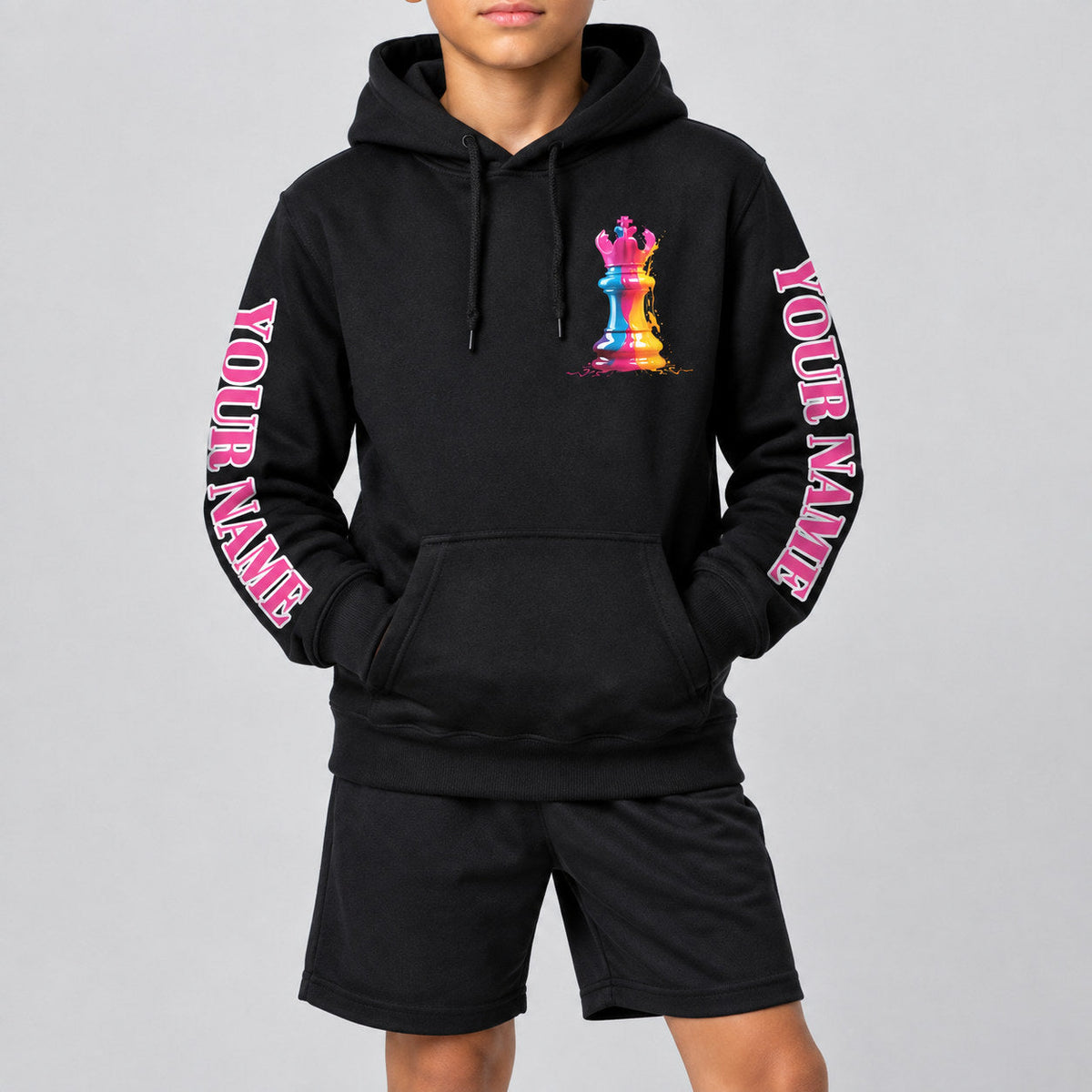 Custom Black Watercolor Chess Piece International Day Pullover Hoodie with Pink and White Lettering youth size worn by child model
