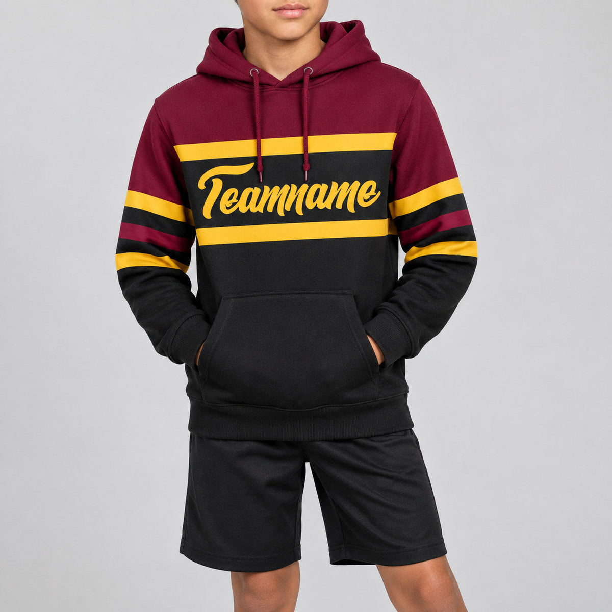 Custom Black Line Pullover Hoodie with Gold and Crimson Lettering youth size worn by child model